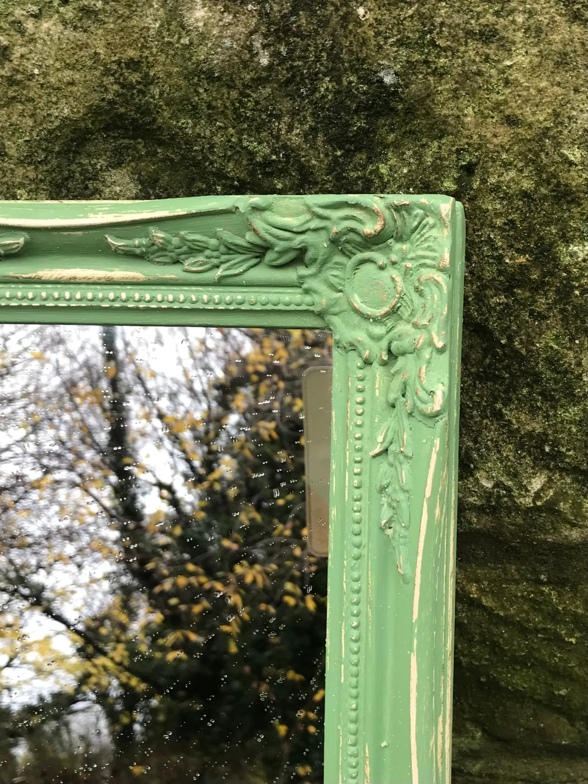 Ornate small wall mirror updated in  green